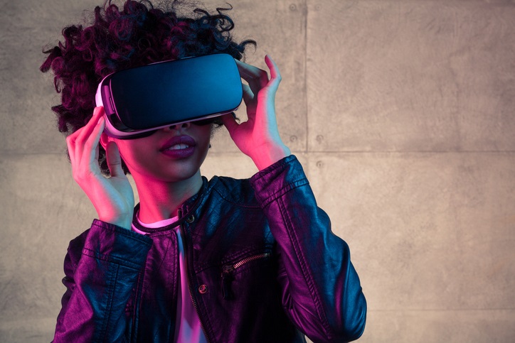 A girl wearing a virtual reality headset.